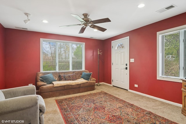 carpeted living area featuring visible vents, recessed lighting, and ceiling fan