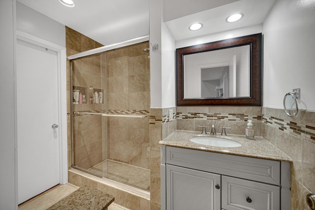 791 Overland Ct, Roselle, IL 60172 - bathroom with vanity, a stall shower, recessed lighting, and tile walls