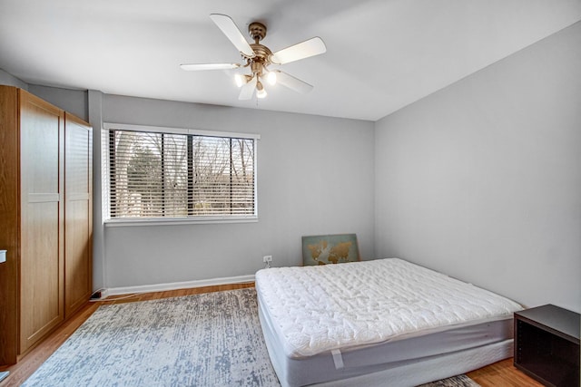 791 Overland Ct, Roselle, IL 60172 - bedroom with baseboards, ceiling fan, and light wood-type flooring