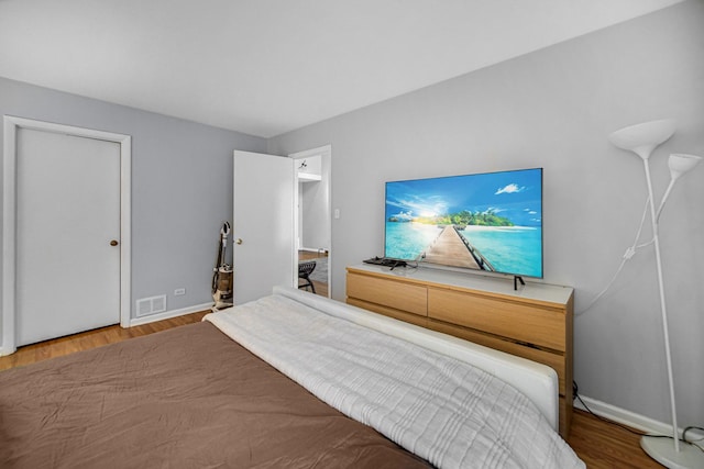 791 Overland Ct, Roselle, IL 60172 - bedroom featuring baseboards, wood finished floors, and visible vents