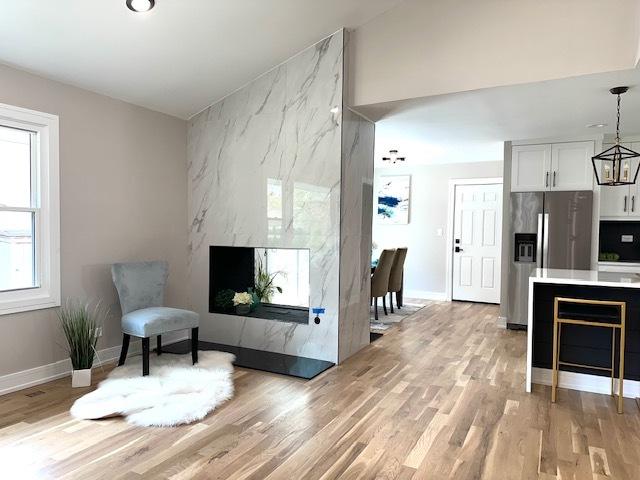 interior space featuring light wood-style floors and baseboards