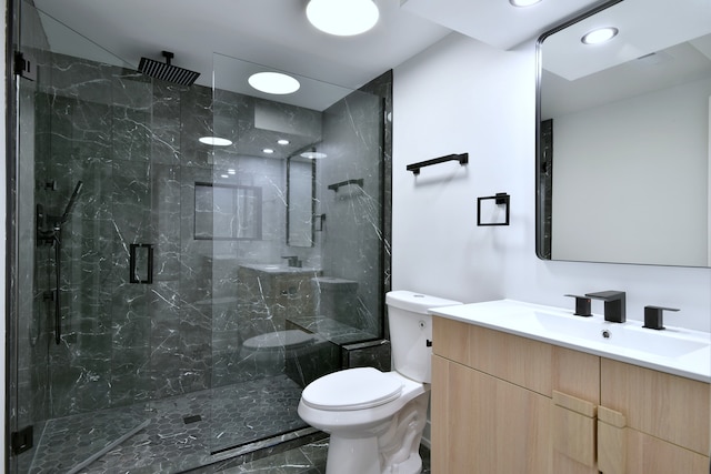 full bath with a marble finish shower, toilet, recessed lighting, vanity, and marble finish floor