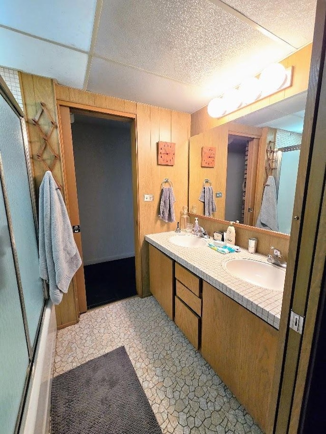 12211 S 93rd Ave, Palos Park, IL 60464 - bathroom with double vanity, combined bath / shower with glass door, and wooden walls