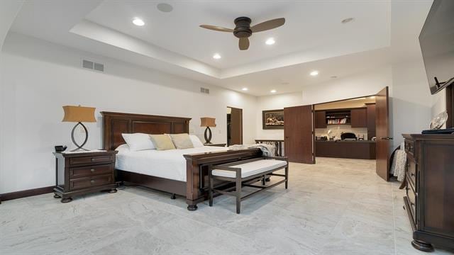 bedroom featuring visible vents, recessed lighting, and a raised ceiling