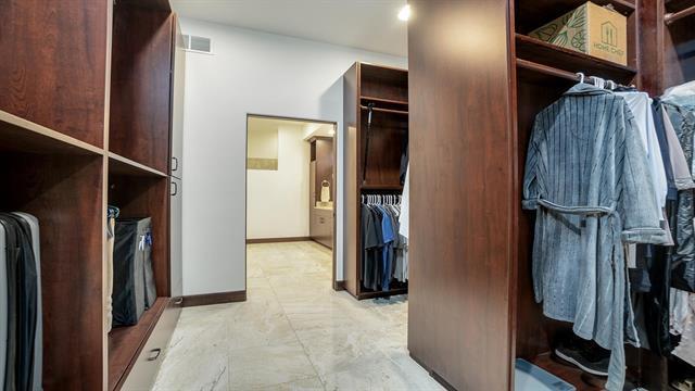 spacious closet featuring visible vents