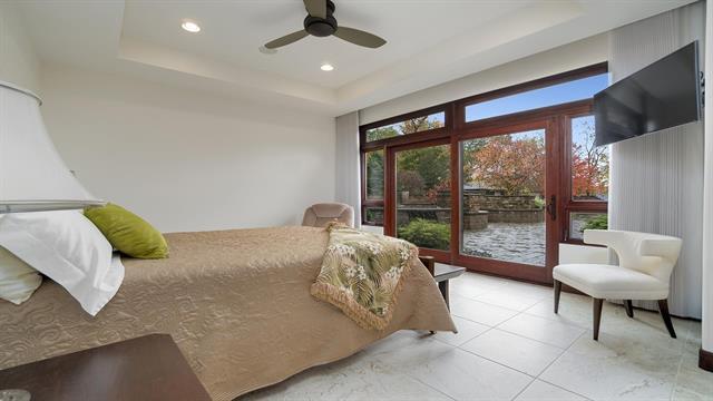 bedroom featuring tile patterned floors, access to exterior, recessed lighting, ceiling fan, and a raised ceiling