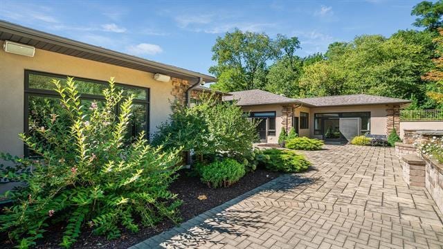 exterior space featuring stucco siding