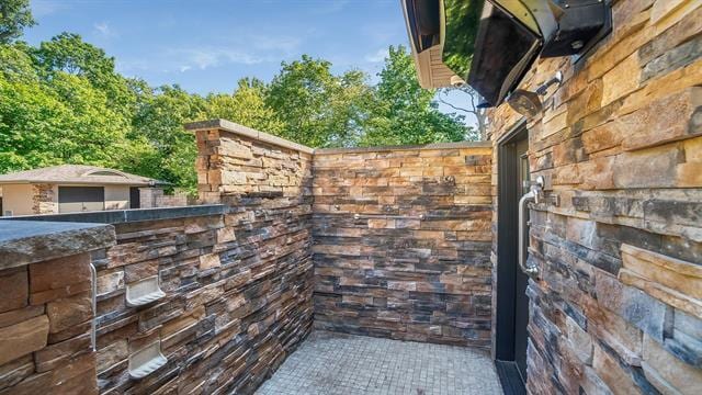 view of home's exterior with stone siding