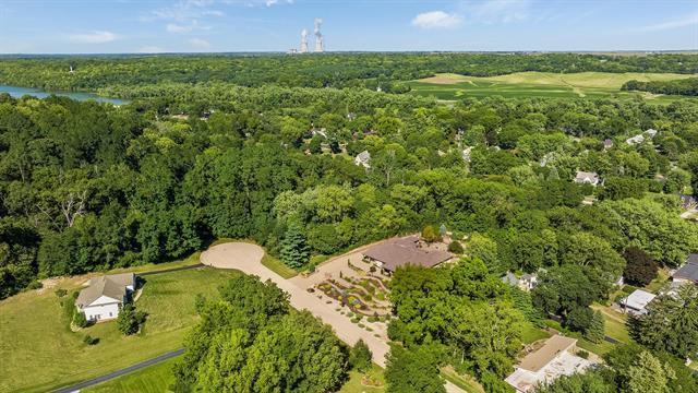 bird's eye view featuring a forest view and a water view