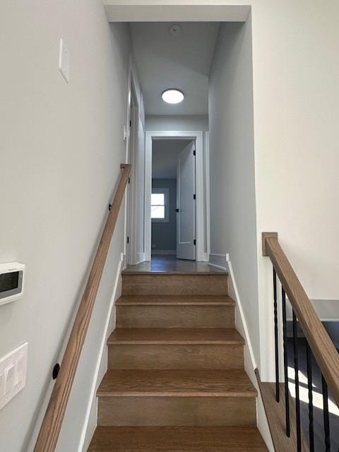 staircase featuring wood finished floors
