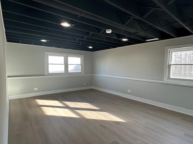 empty room with wood finished floors and baseboards