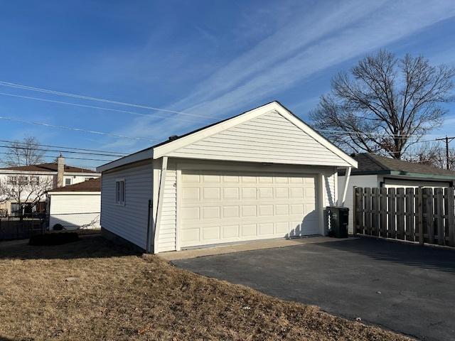 detached garage with fence