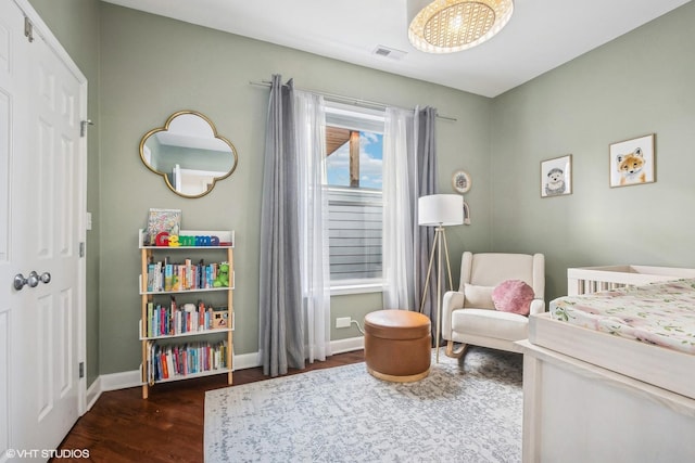 3705 N Paulina St Unit 3, Chicago, IL 60613 - bedroom featuring visible vents, baseboards, and wood finished floors