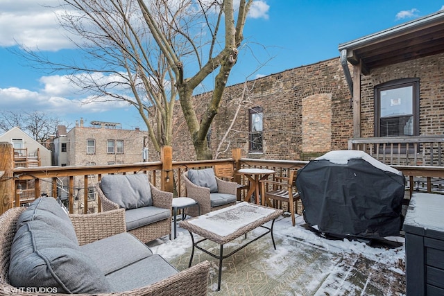 3705 N Paulina St Unit 3, Chicago, IL 60613 - snow covered deck with an outdoor hangout area and area for grilling