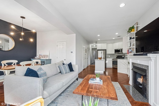3705 N Paulina St Unit 3, Chicago, IL 60613 - living room featuring recessed lighting, a fireplace with flush hearth, and dark wood-type flooring