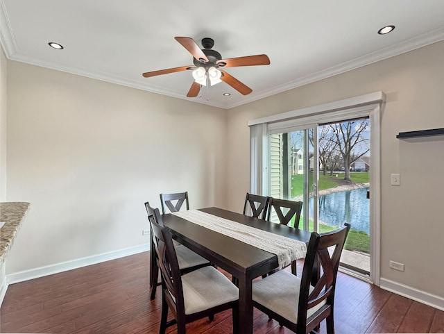 dining space featuring crown molding, baseboards, ceiling fan, dark wood-type flooring, and recessed lighting