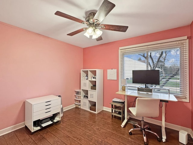 office space featuring baseboards, ceiling fan, and wood finished floors