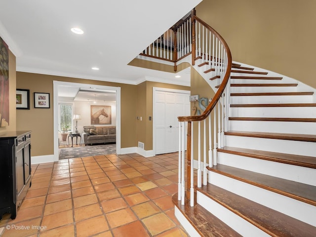 stairway with tile patterned floors, visible vents, baseboards, recessed lighting, and crown molding