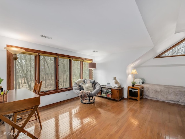 sitting room featuring light wood-type flooring and visible vents