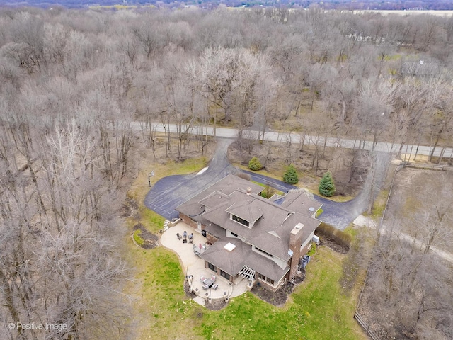 birds eye view of property with a wooded view