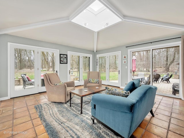 living room featuring vaulted ceiling and french doors