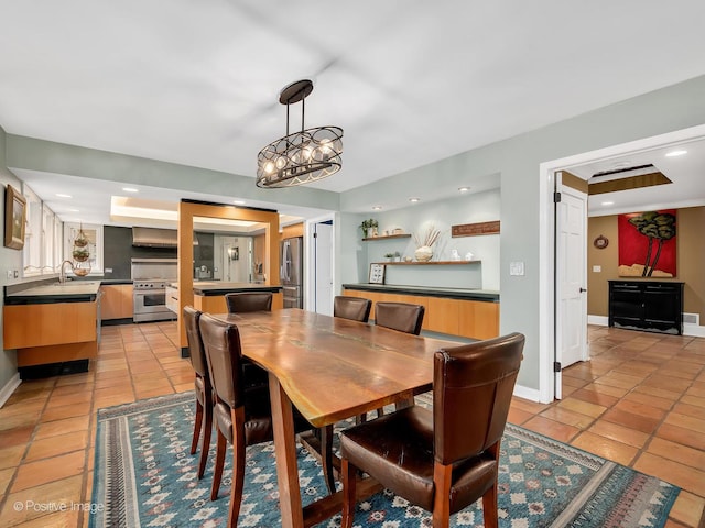 dining area with baseboards, recessed lighting, and light tile patterned flooring