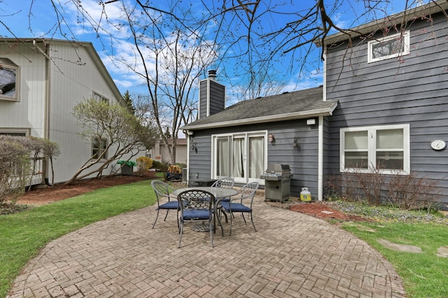 view of patio featuring outdoor dining area and a grill