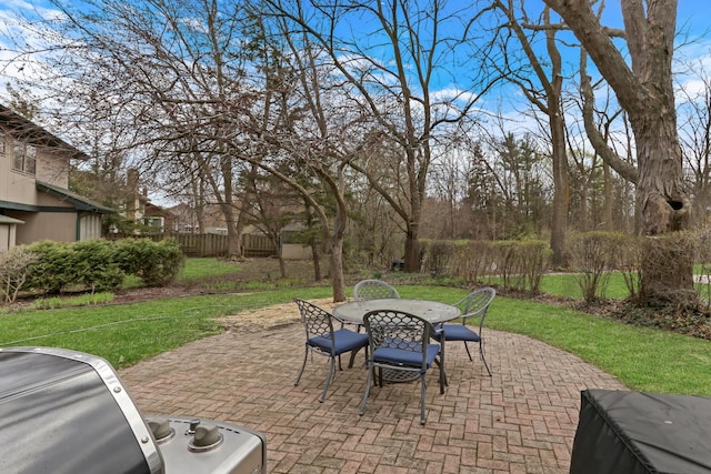 view of patio featuring fence and outdoor dining space