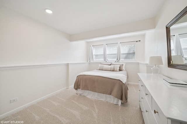carpeted bedroom with baseboards