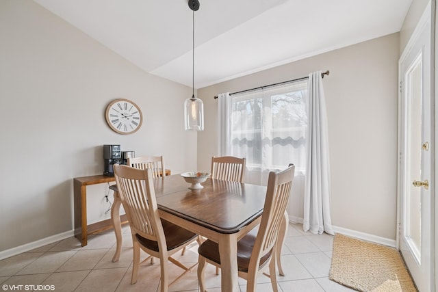 dining room with light tile patterned flooring and baseboards