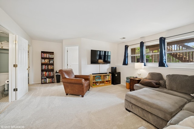 living room with light carpet and visible vents