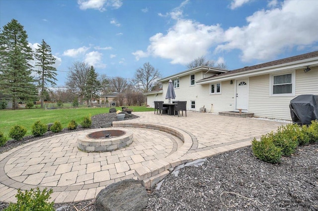 view of patio / terrace featuring an outdoor fire pit