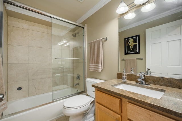 bathroom featuring ornamental molding, toilet, bath / shower combo with glass door, and vanity