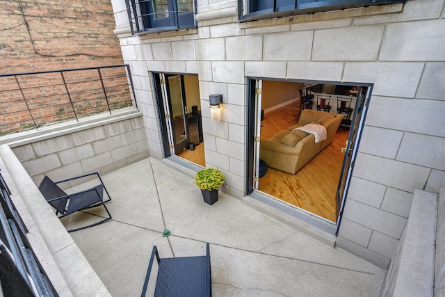 view of patio featuring a balcony