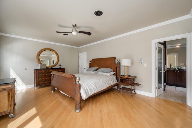 bedroom with light wood finished floors, crown molding, baseboards, and a ceiling fan