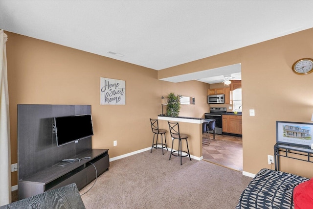 living room featuring baseboards, visible vents, and light colored carpet
