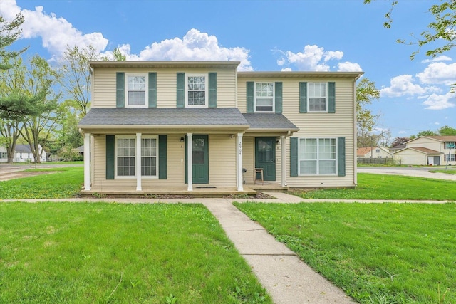 view of front of house with a porch and a front yard