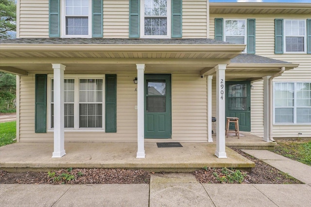 entrance to property featuring a porch