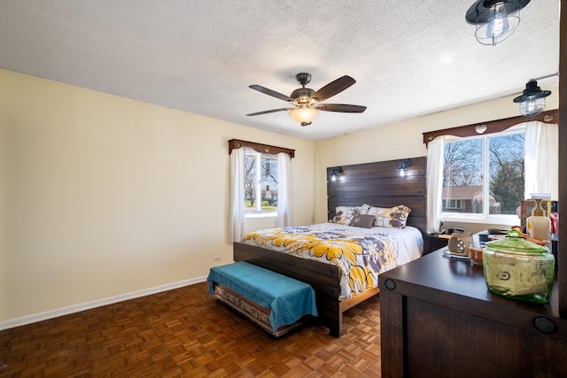 2532 Lee St, Woodridge, IL 60517 - bedroom with ceiling fan, baseboards, multiple windows, and a textured ceiling