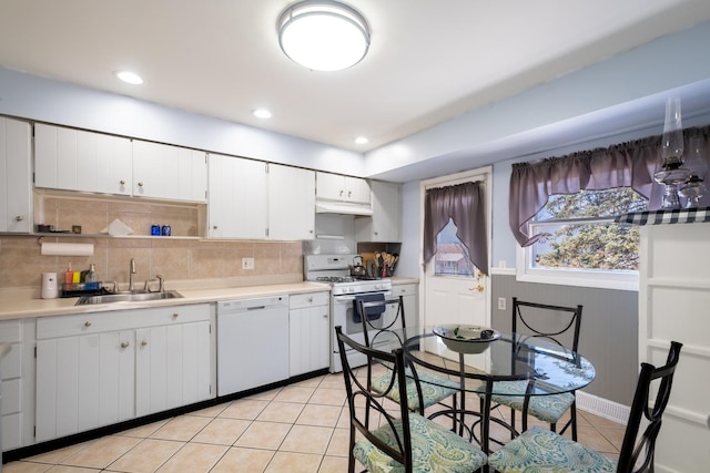 2532 Lee St, Woodridge, IL 60517 - kitchen featuring a sink, light tile patterned flooring, white appliances, light countertops, and white cabinets
