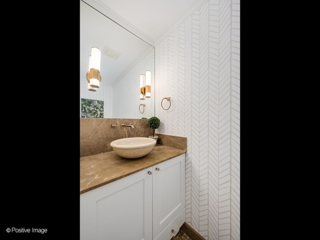 bathroom featuring vaulted ceiling, vanity, and decorative backsplash