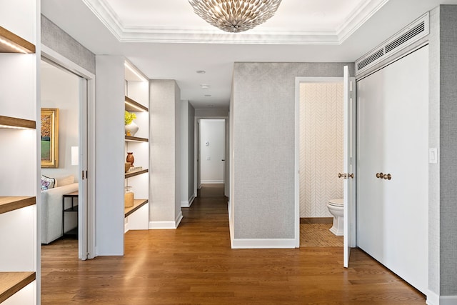 hall featuring ornamental molding and wood finished floors