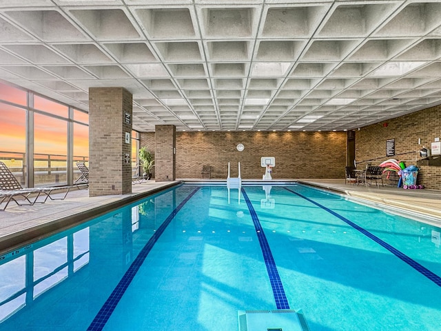 view of pool at dusk