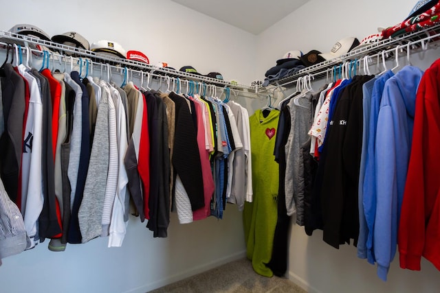 walk in closet featuring carpet