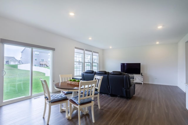 dining area featuring dark wood-type flooring, visible vents, and recessed lighting