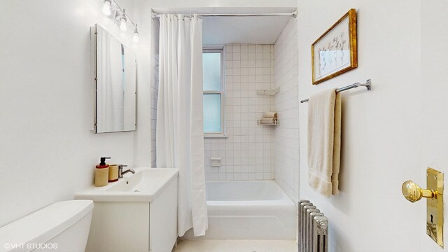 full bathroom with shower / tub combo, radiator, and toilet