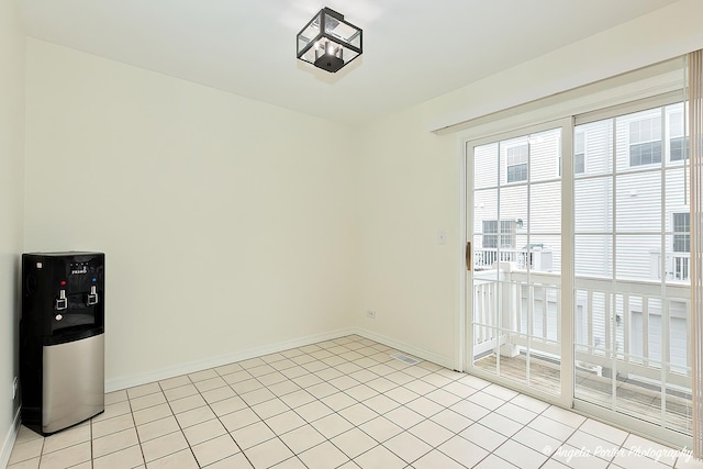 131 W Big Horn Dr Unit 131, Hainesville, IL 60030 - empty room with light tile patterned flooring and baseboards