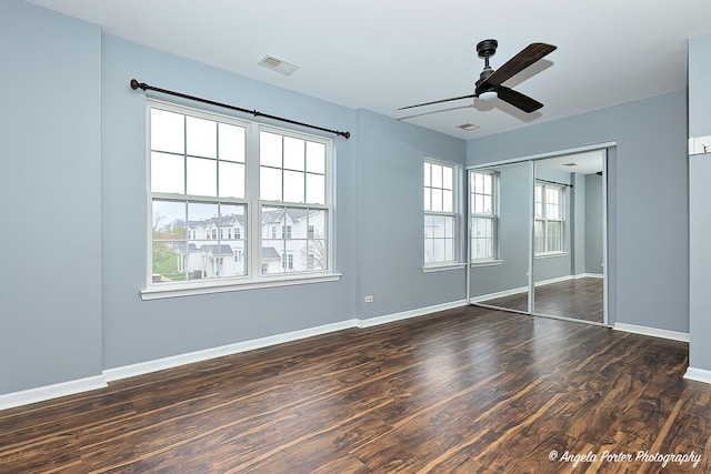 131 W Big Horn Dr Unit 131, Hainesville, IL 60030 - unfurnished bedroom with a ceiling fan, wood finished floors, a closet, baseboards, and visible vents