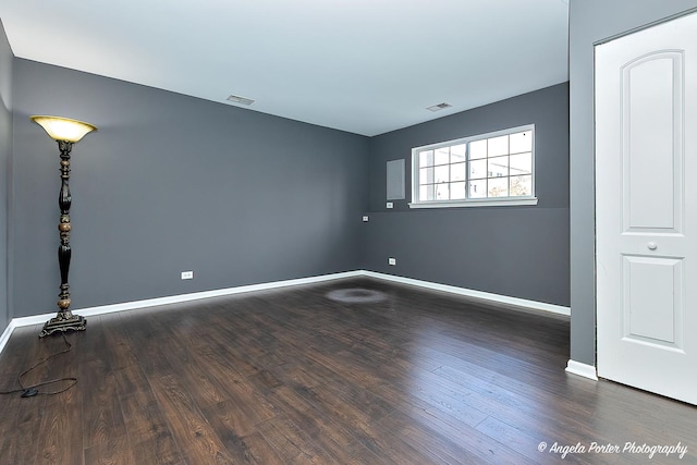 131 W Big Horn Dr Unit 131, Hainesville, IL 60030 - unfurnished room featuring baseboards, visible vents, and dark wood-style floors