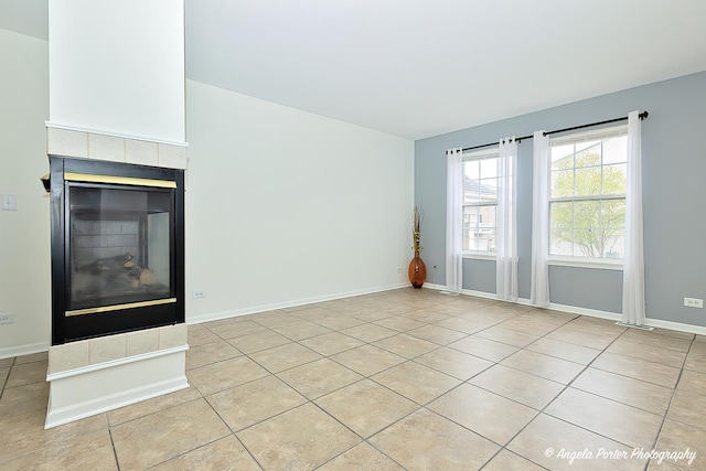 131 W Big Horn Dr Unit 131, Hainesville, IL 60030 - unfurnished living room with baseboards, a fireplace, and light tile patterned floors
